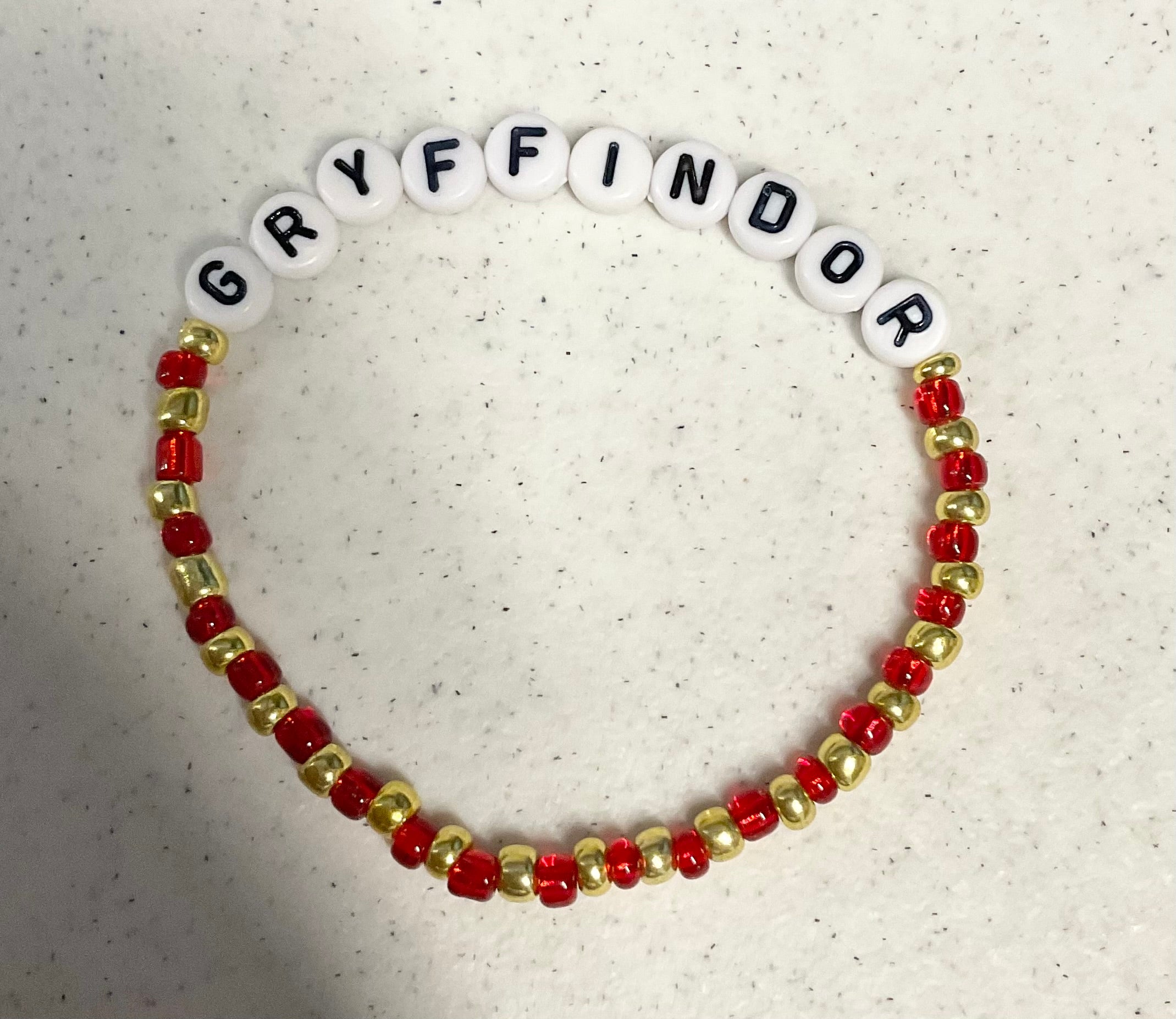 Magical red and gold wizard house bracelet