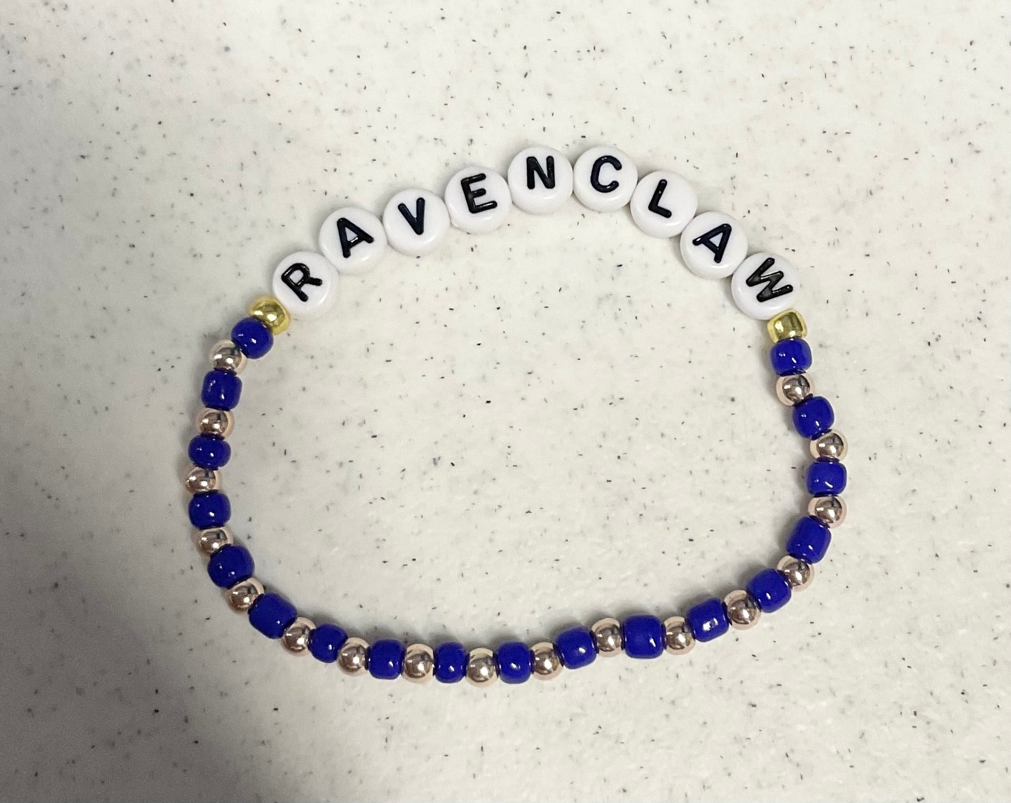Magical blue and bronze wizard house bracelet